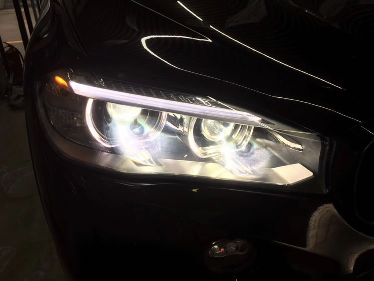 宝马x5西安改装车灯 升级海拉5透镜飞利浦氙气灯天使眼等